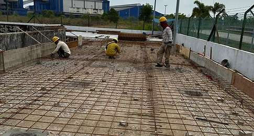 Workers fixing slab reinforcement