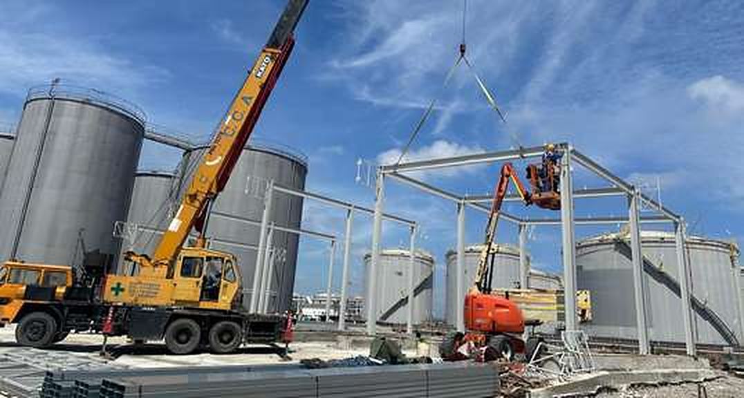 Crane lifting roof beams