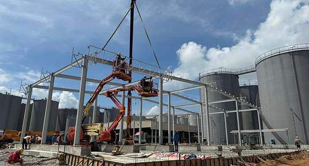Steel portal frames being lifted into place